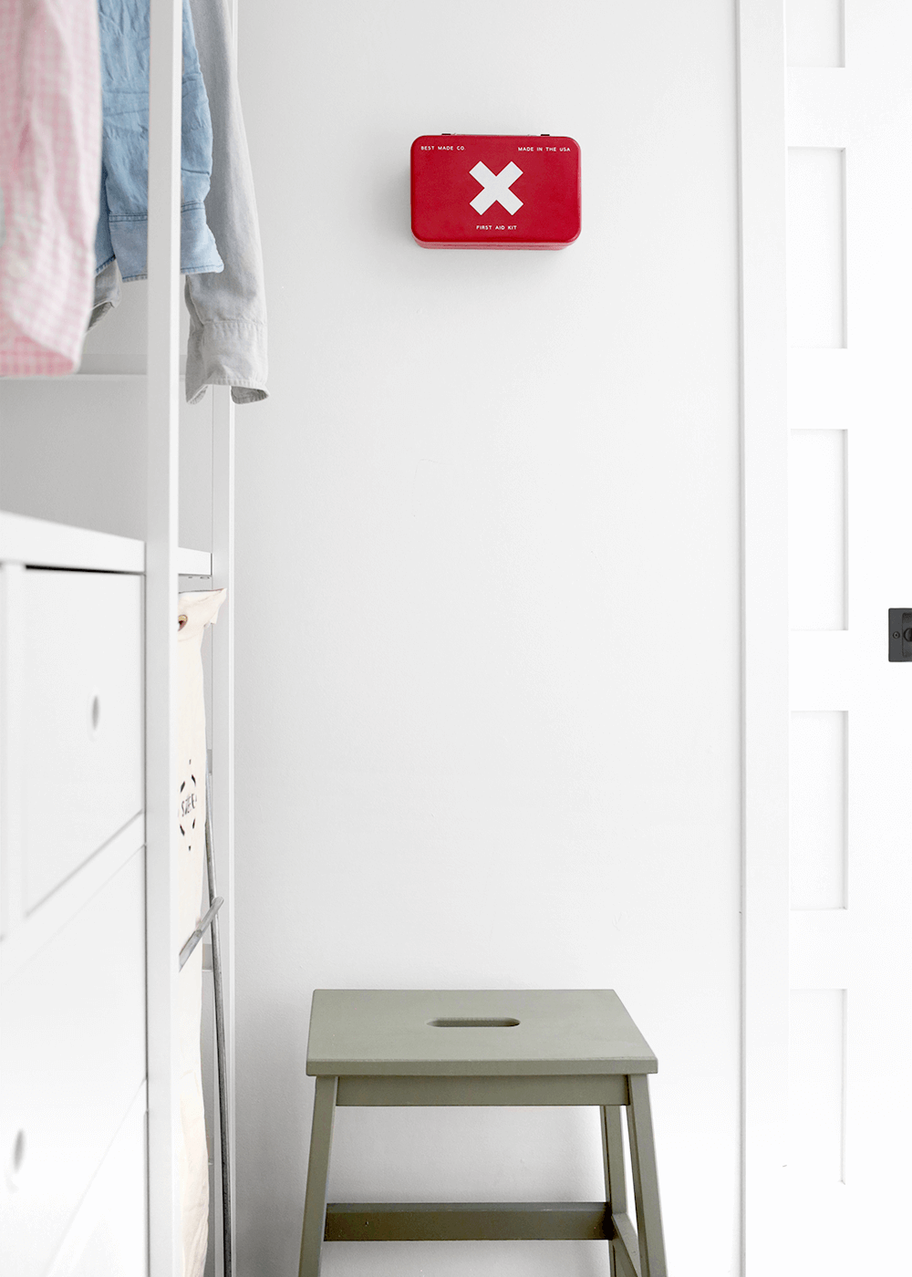 The Faux Martha laundry room with red medical kit