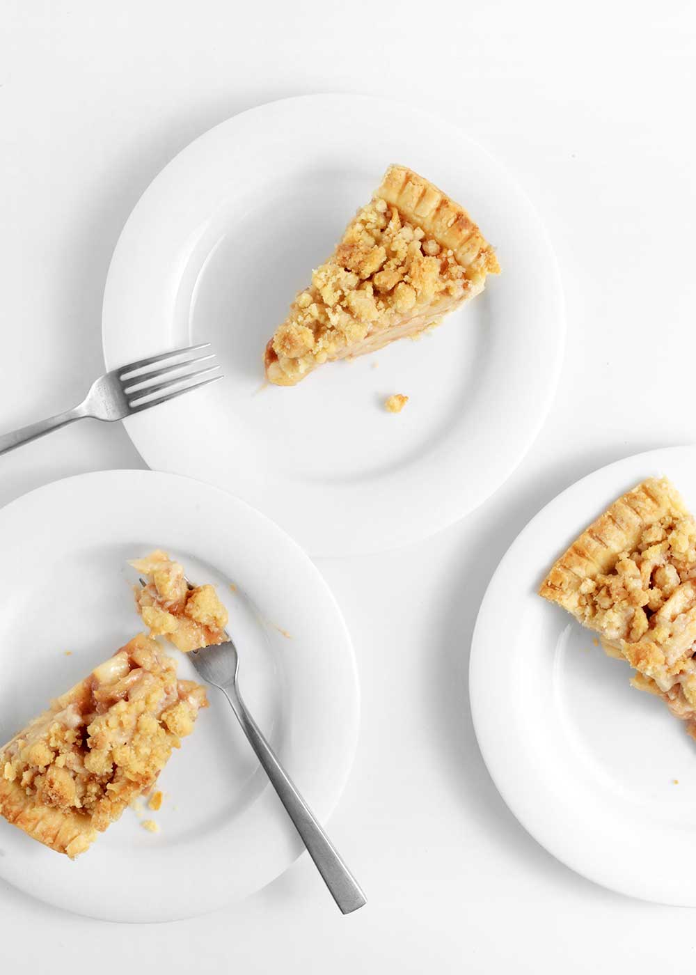 slice of almond apple pie with a crumble from the faux martha