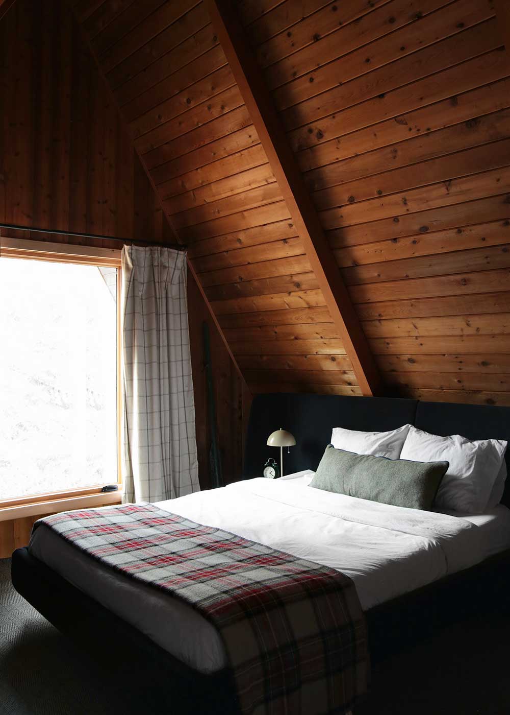 The Minne Stuga A-frame cabin bedroom reveal from the faux martha