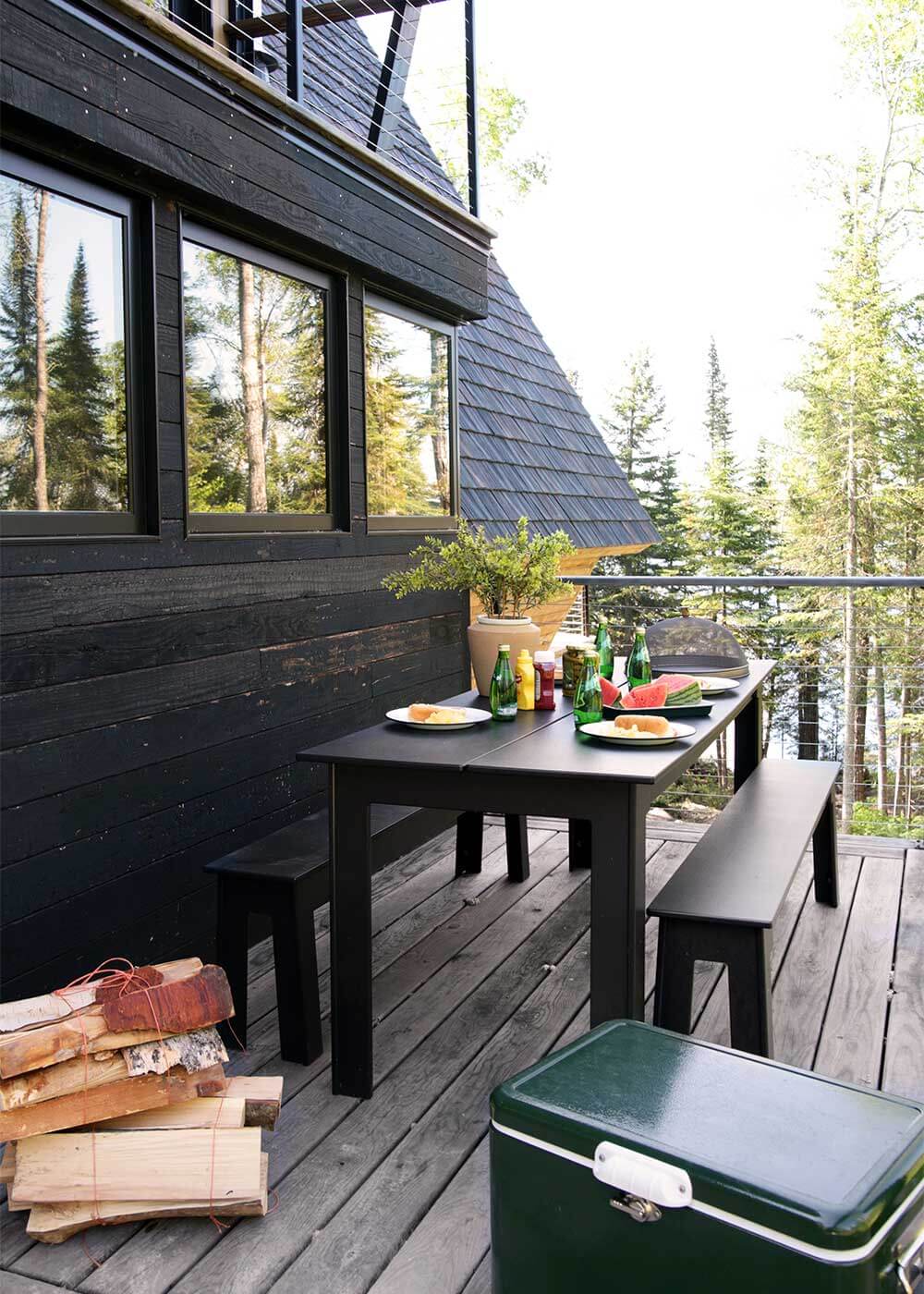 The Minne Stuga outdoor decks with Loll Fresh Air Table